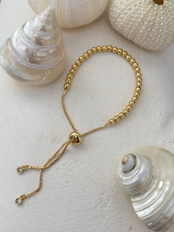 Armbandje met trekkoord, 4 mm kralen, goldplated